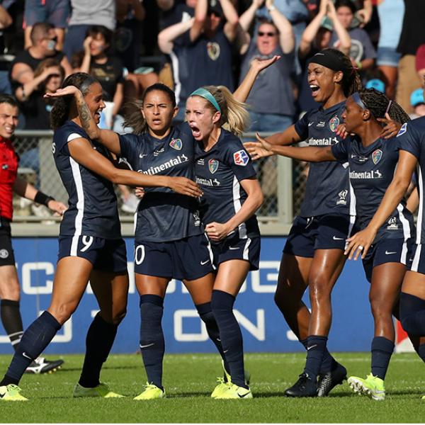 NC Courage players celebrating a goal