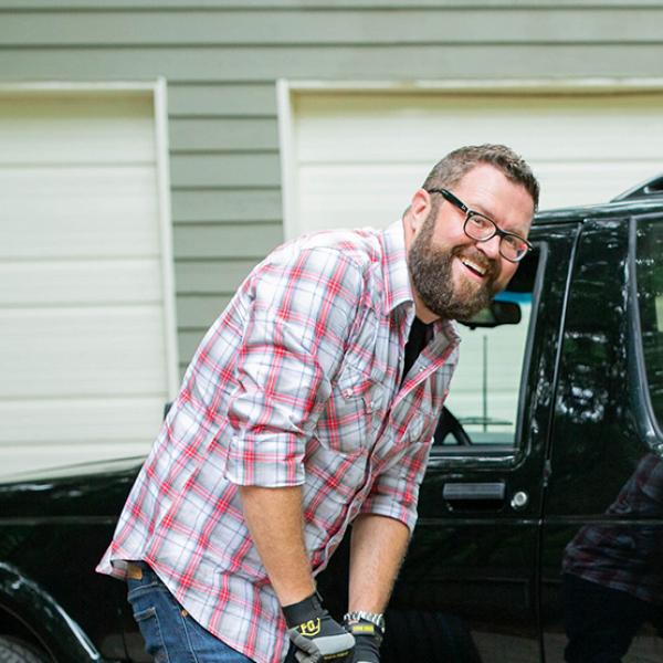 Rutledge Wood posing next to his ride