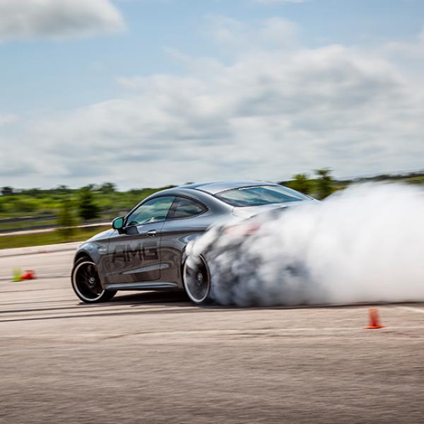 Mercedes performing a burnout on academy course